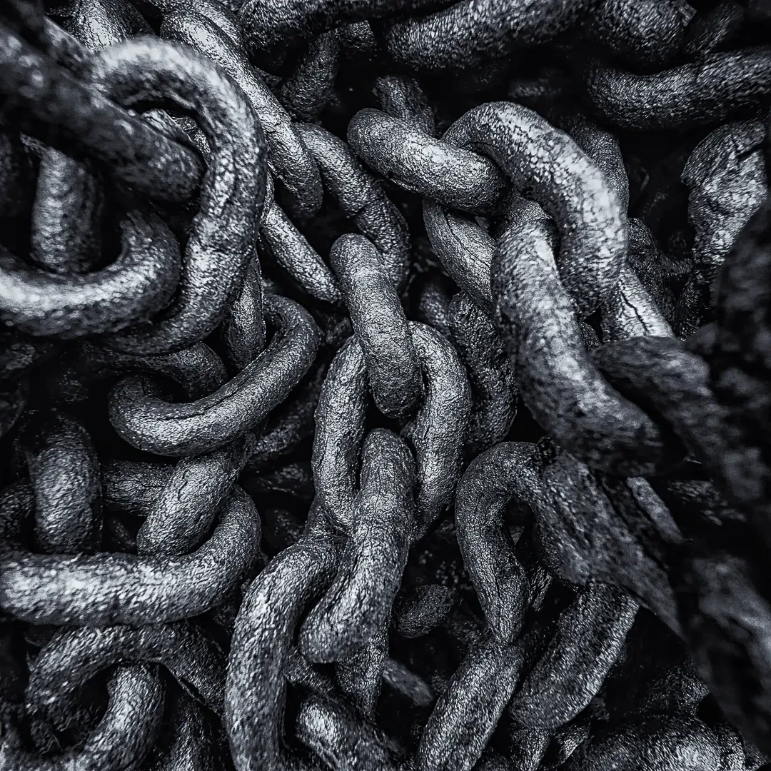 Black and white close-up of heavy anchor chains